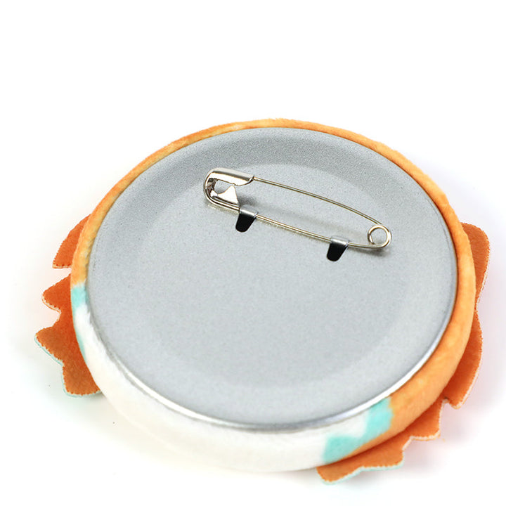 Back view of custom 3D plush head button pin with metal safety pin clasp