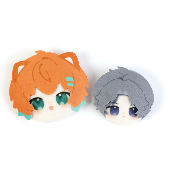 Custom 3D plush anime head button pins featuring orange and gray cartoon characters.