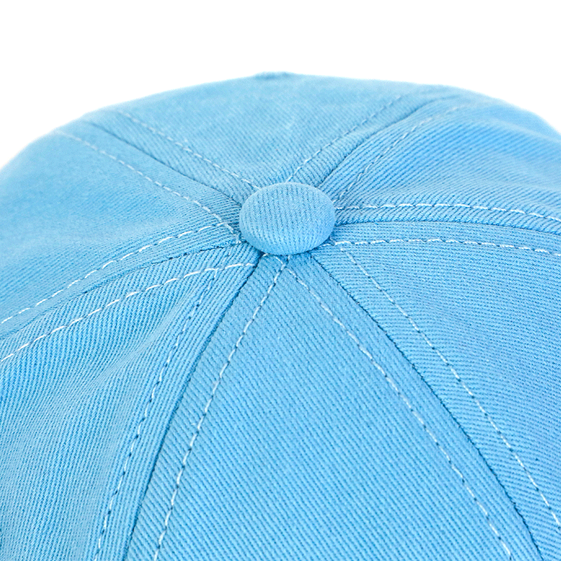 Close up of light blue custom baseball cap with stitched panel details