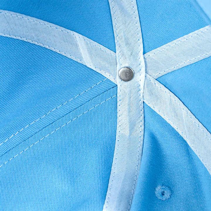 Close-up of blue custom baseball cap interior stitching and metal button detail