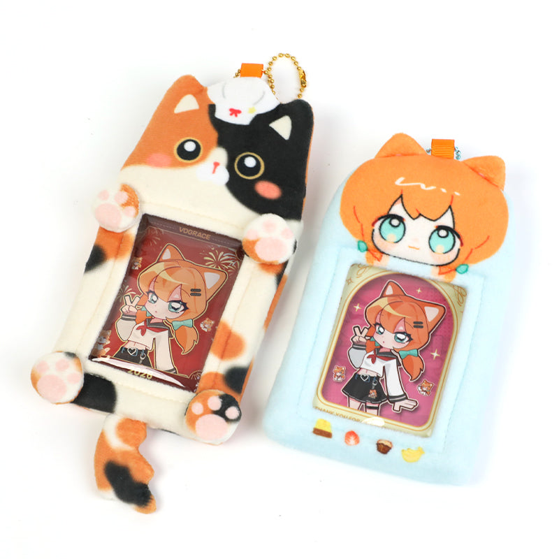 Two cute plush card holders shaped like cartoon cats with anime character cards inside
